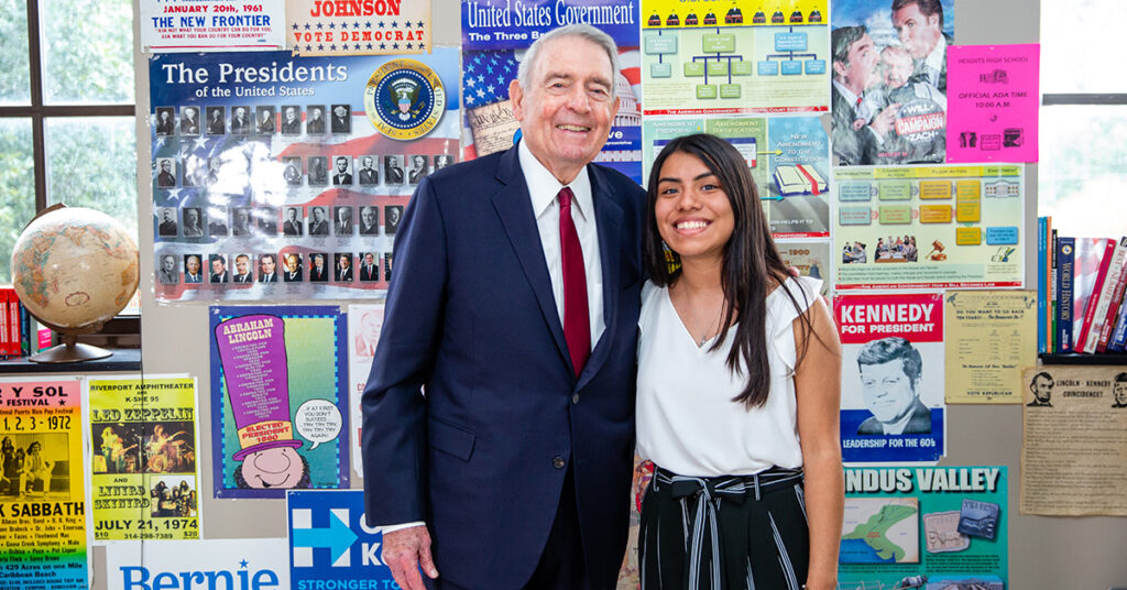 Dan Rather poses with high school student