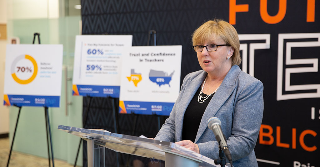 Dr. Shari Albright stands at a podium to present key findings from the 2020 Texas Education Poll