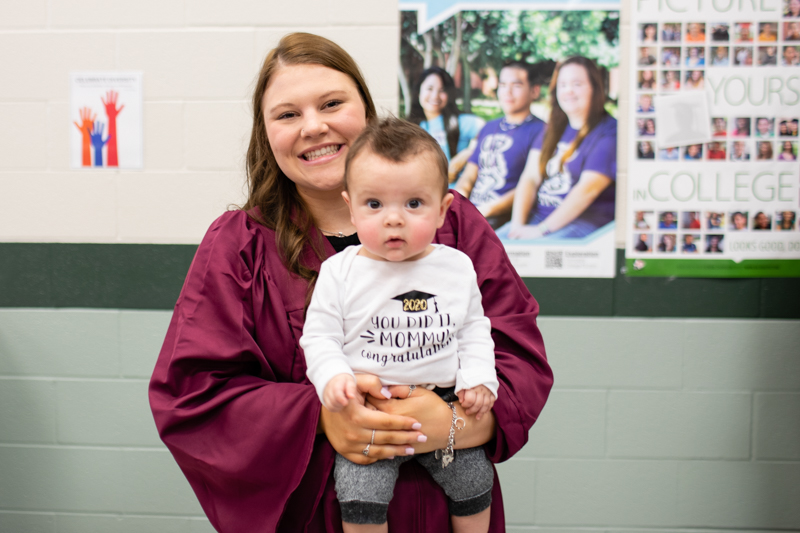 Hailee Fitts poses with her son on graduation day.