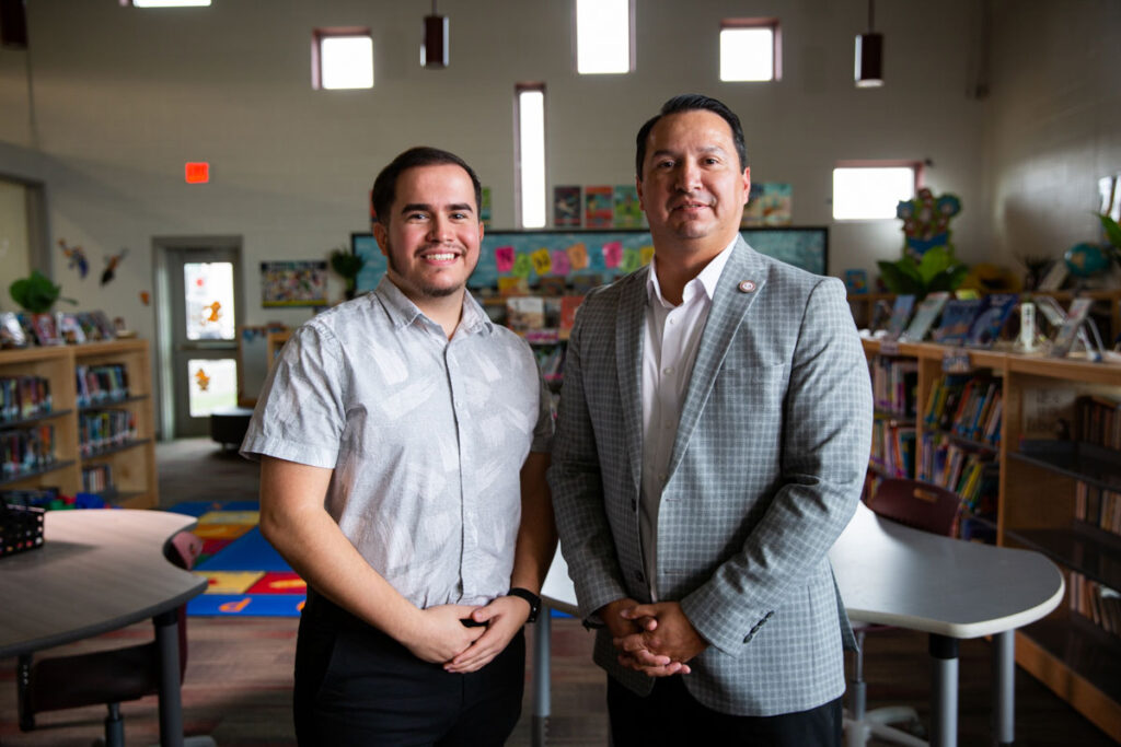 Mark Estrada, the superintendent of Lockhart ISD, became Uriel Iglesias’ mentor through the Charles Butt Scholarship mentor program. The two pose together for the camera.
