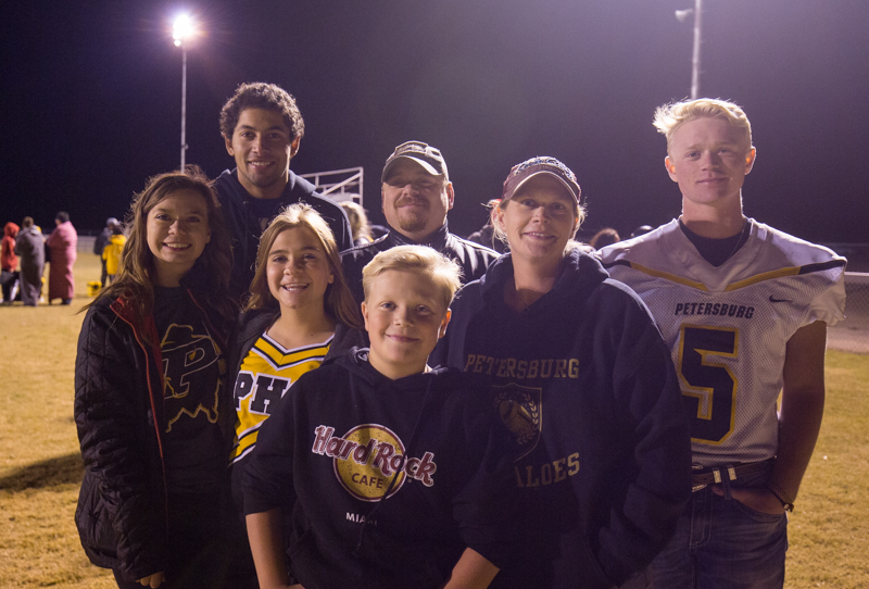 The McWilliams family poses for a group photo following the end of a Friday Night Football game.