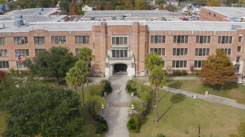 A sweeping drone shot of heights high school in Houston ISD