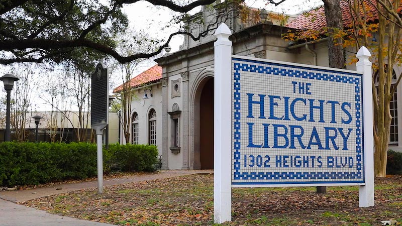 Featured is an old library building with a sign out from that reads: "The Heights Library"