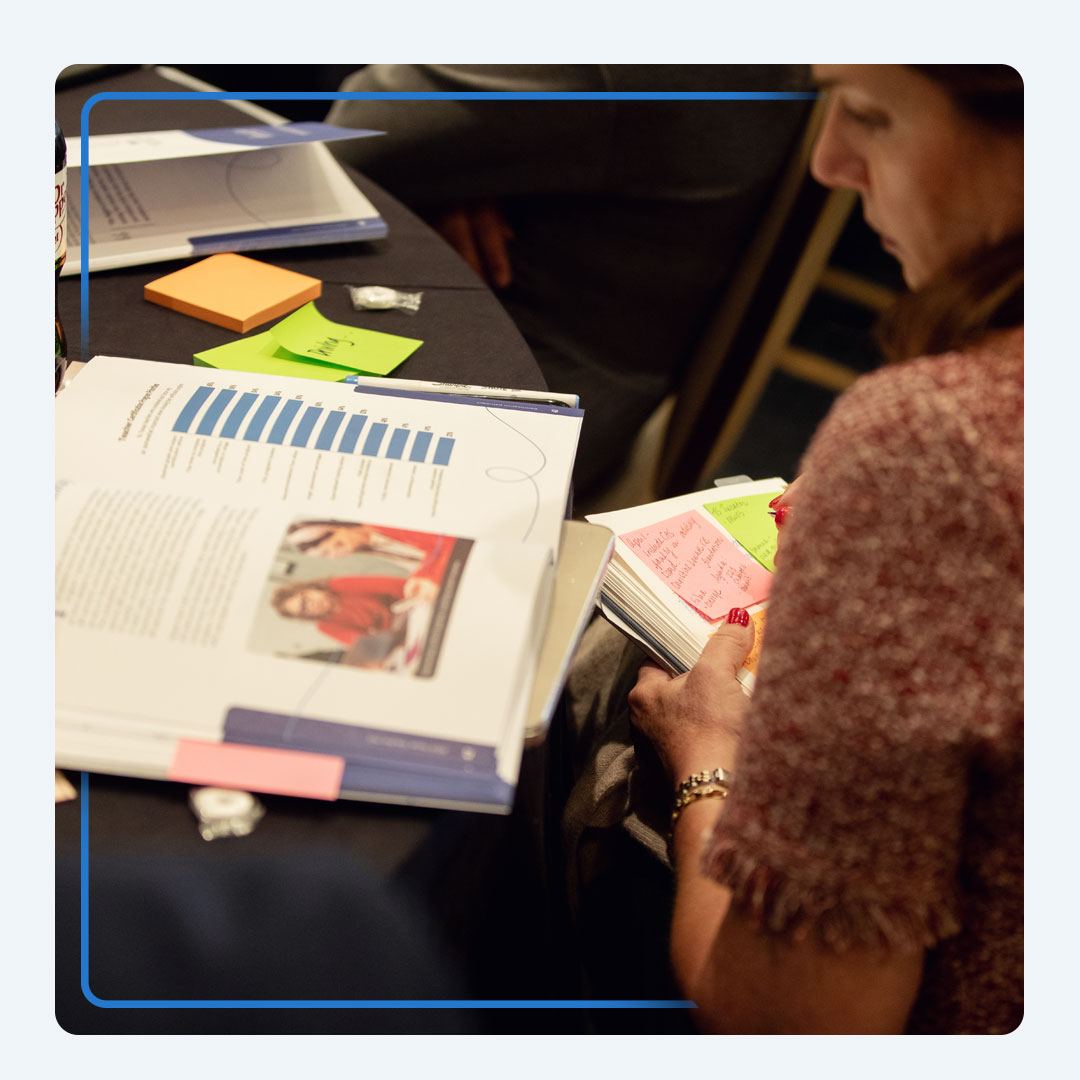 Event attendee evaluates the latest report on education issues.