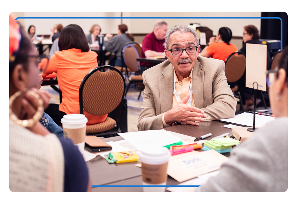 Full room of attendees interact with one another at the 2024 Emerging Partners Spring Convening. 