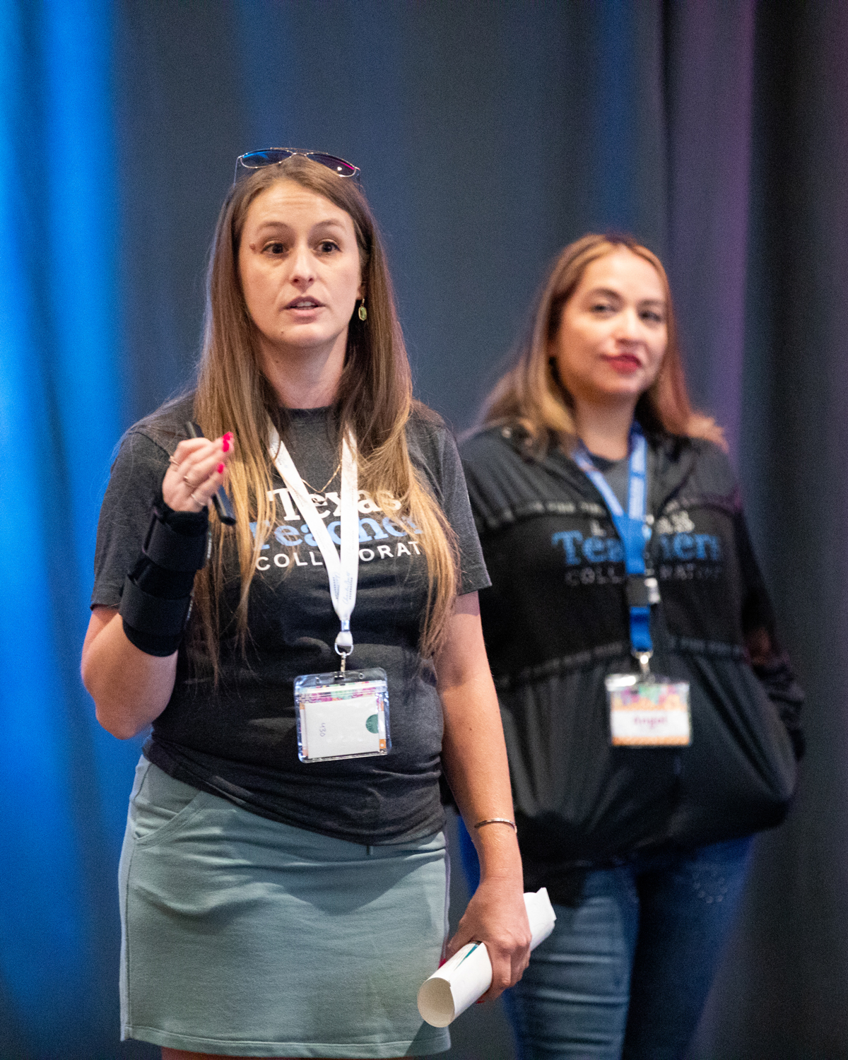 Texas Teachers Collaborative participants present in front of their cohort team members at the 2025 summer workshop retreat.