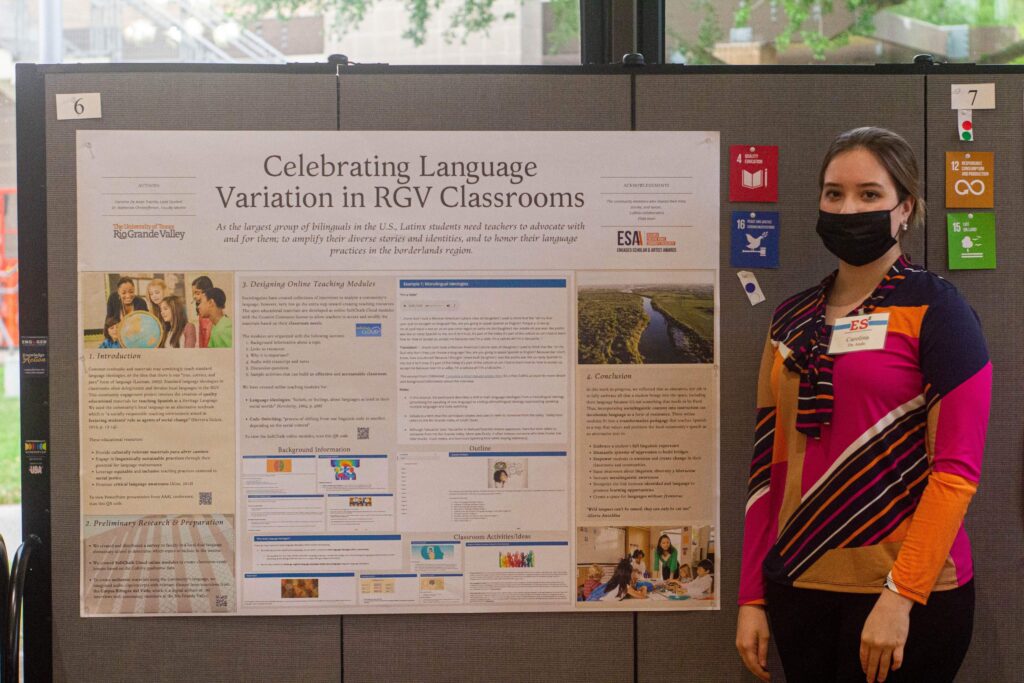 UTRGV Undergrad Research_Carolina stands beside a large scale poster showcasing her research work